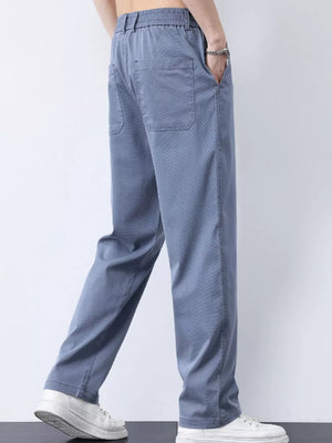 Relaxed fit light blue cargo pants with elastic waist and back pockets.