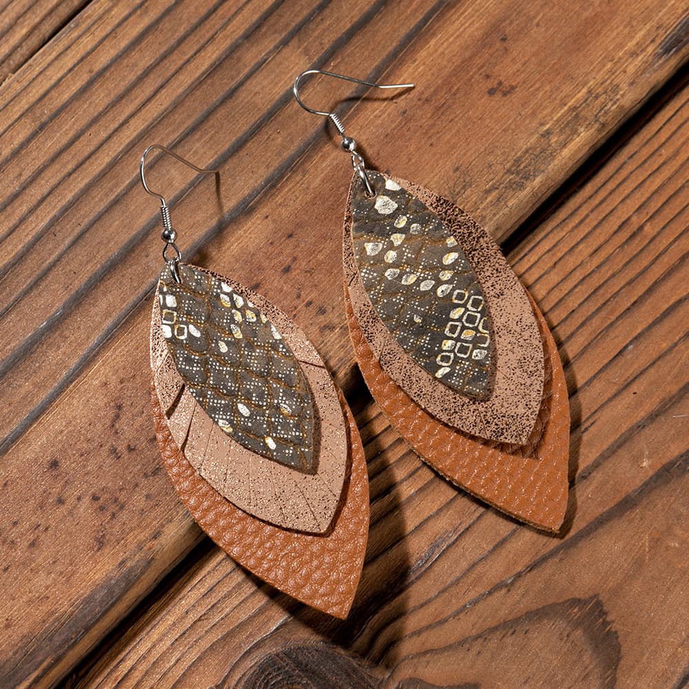 Layered faux leather statement earrings in brown with metallic speckled pattern.