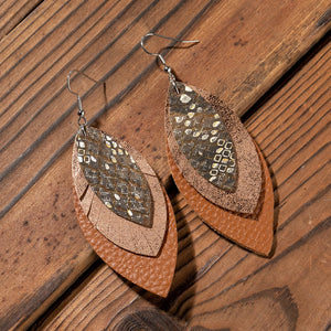 Layered faux leather statement earrings in brown with metallic speckled pattern.
