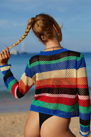 Striped crochet beach cover-up sweater with a blue neckline and cuffs.