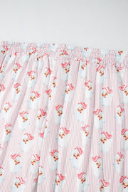 Santa stripe lounge set in blush pink with a playful Santa Claus print and pinstripe pattern.