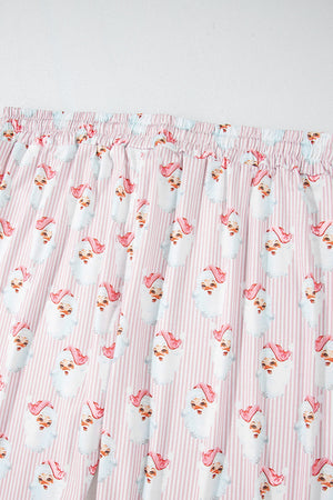 Santa stripe lounge set in blush pink with a playful Santa Claus print and pinstripe pattern.