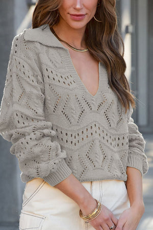 Gray openwork collar knit sweater with V-neck and long sleeves.