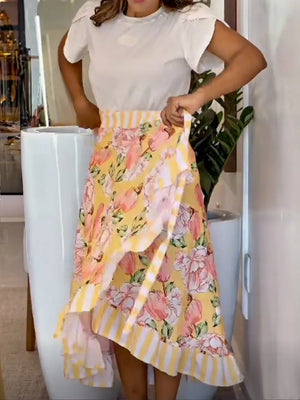 Yellow floral print wrap skirt with ruffled hem and striped waistband.