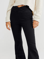 Black flare denim jeans with a unique V-shaped waist detail.