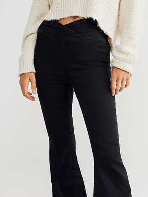 Black flare denim jeans with a unique V-shaped waist detail.