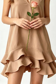 Tiered ruffle hem mini dress in taupe with V-neck.