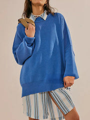 Oversized royal blue ribbed knit sweater with drop shoulders and wide sleeves.