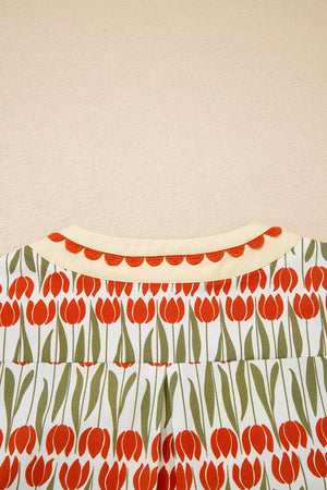 Cotton mini dress with vibrant red tulip print, cream collar, and scalloped trim.