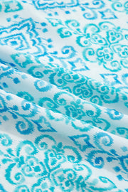 Patchwork ruffle mini dress in blue with ornate ikat print fabric detail