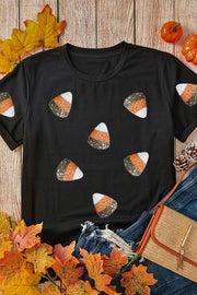 Black t-shirt with scattered sequined candy corn pattern.