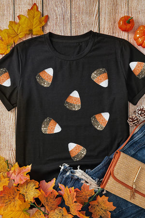 Black t-shirt with scattered sequined candy corn pattern.