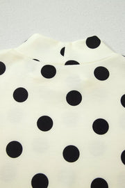 Cream polyester t-shirt with black polka dots and high neckline