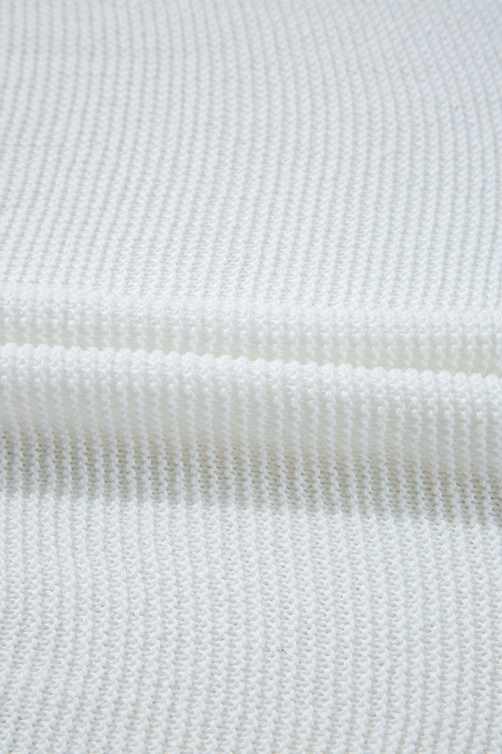 White knit crop top showing textured acrylic fabric detail