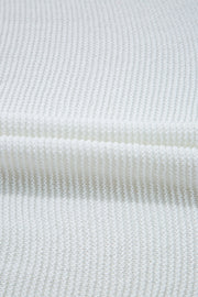 White knit crop top showing textured acrylic fabric detail