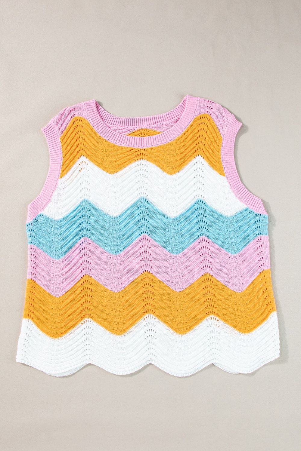 Chevron knit tank top with multicolor stripes and scalloped hem.