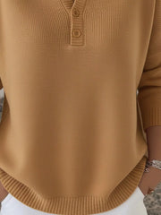 Buttoned long-sleeve knit top in brown with a Henley neckline and ribbed hem.