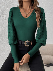 Dark green ribbed bodysuit with sheer pom-pom sleeves and V-neck