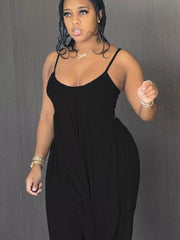 Black cami and wide-leg pants set with asymmetrical draped hem.