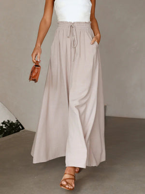 Gathered waist wide-leg palazzo pants in eggshell with drawstring and pockets.