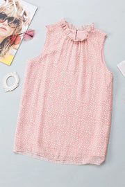 Blush pink sleeveless blouse with ruffled neckline and allover abstract print.