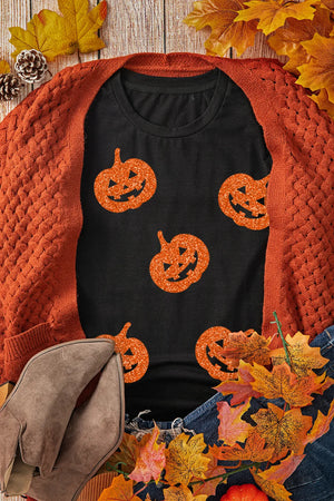 Black cotton t-shirt with glitter pumpkin motif, crew neck, short sleeves.