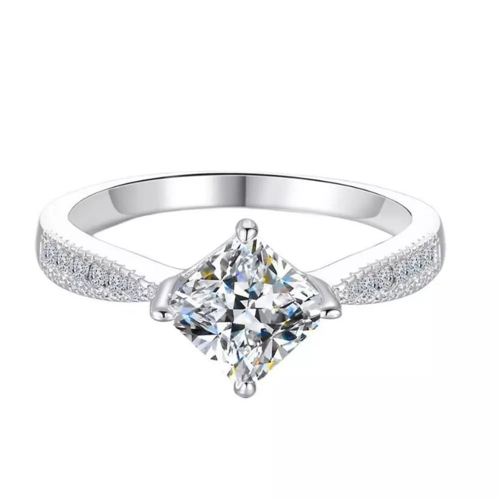 Sterling silver ring with princess-cut moissanite and pave band.