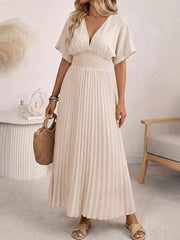 Apricot V-neck midi dress with short sleeves, smocked waist and pleated skirt.