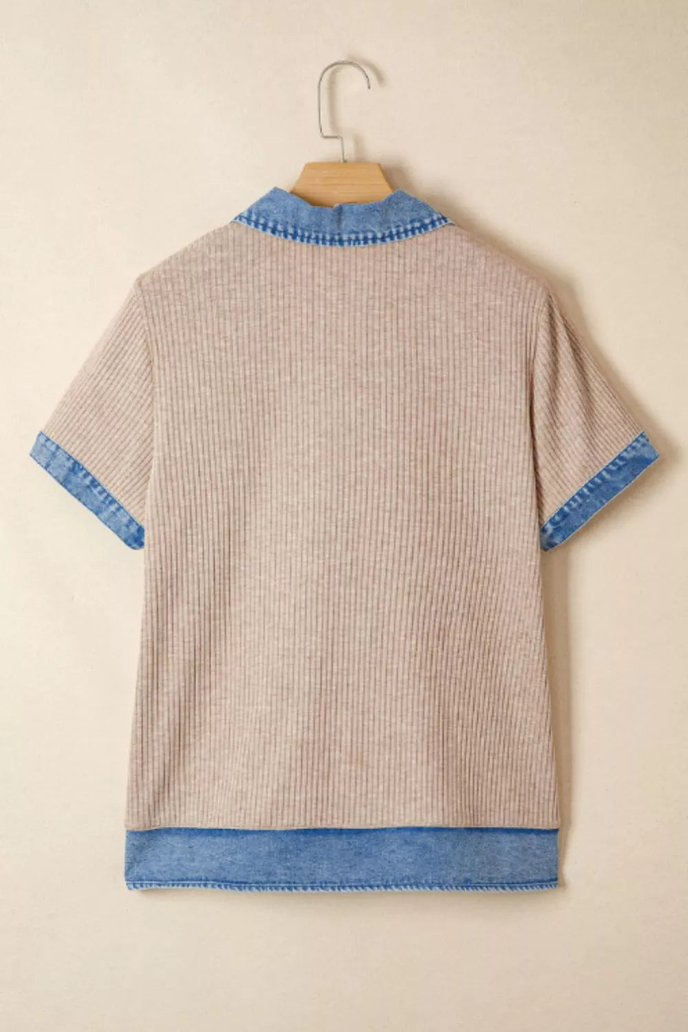Ribbed knit tunic top in beige with a denim collar, short sleeves, and hem detail.