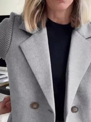 Light gray double-breasted trench coat with knit sleeves and button detail