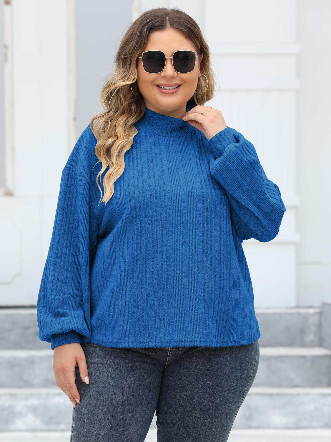 Textured balloon sleeve mock neck sweater in Royal Blue with ribbed detail.