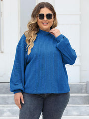 Textured balloon sleeve mock neck sweater in Royal Blue with ribbed detail.