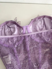 Lavender lace bustier top with 3D butterfly appliques and a bow detail.