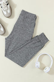 Slim-fit heather gray joggers with drawstring and cuffed ankles.