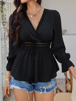 Black Swiss dot wrap blouse with lace trim and tie waist