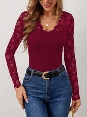 Burgundy ribbed long sleeve top with scalloped lace neckline and sleeves.