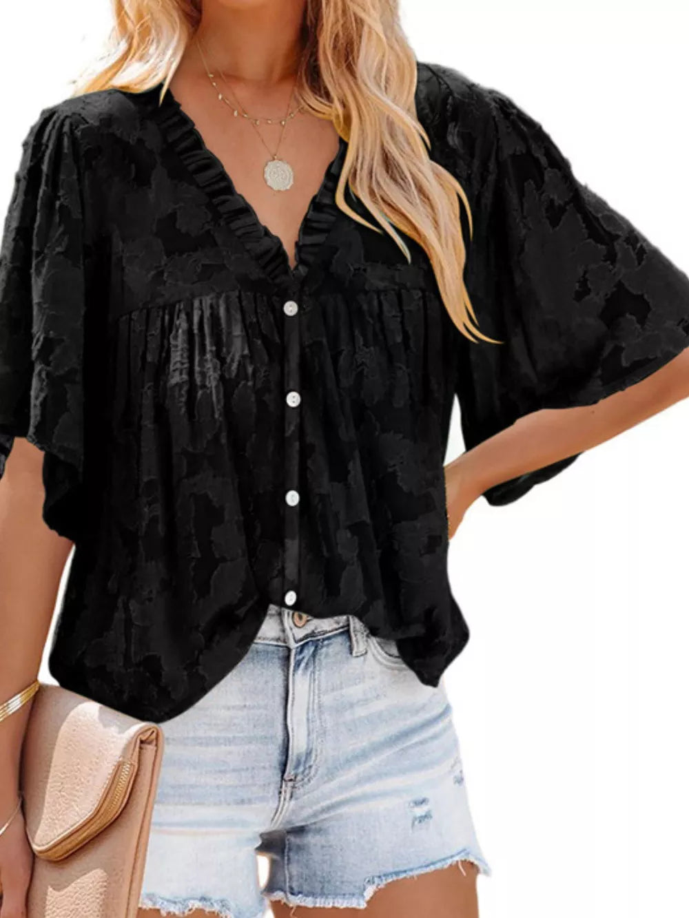Black textured V-neck button-down blouse with ruffled detail and short sleeves.