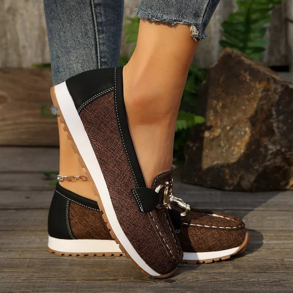 Brown canvas slip-on loafers with buckle detail and white sole