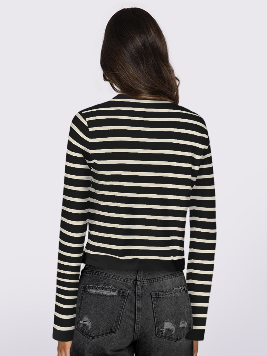 Black and white striped cropped cardigan with long sleeves.