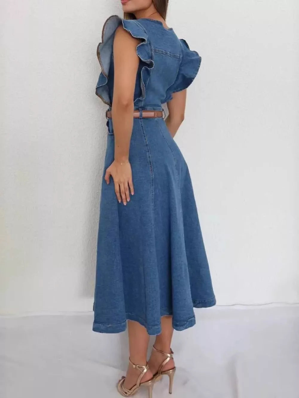 Ruffled denim midi dress with belt, buttoned front, and flared skirt.