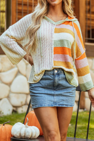 Colorblock knit hoodie with open knit and striped panels, featuring a hood and drawstring.
