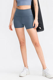 Sculpted Contour athletic shorts in Dusty Blue, high-waisted, form-fitting, with a seamless waistband.