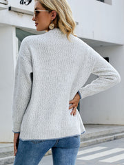 Light gray textured knit cardigan with contrast trim and crew neck.