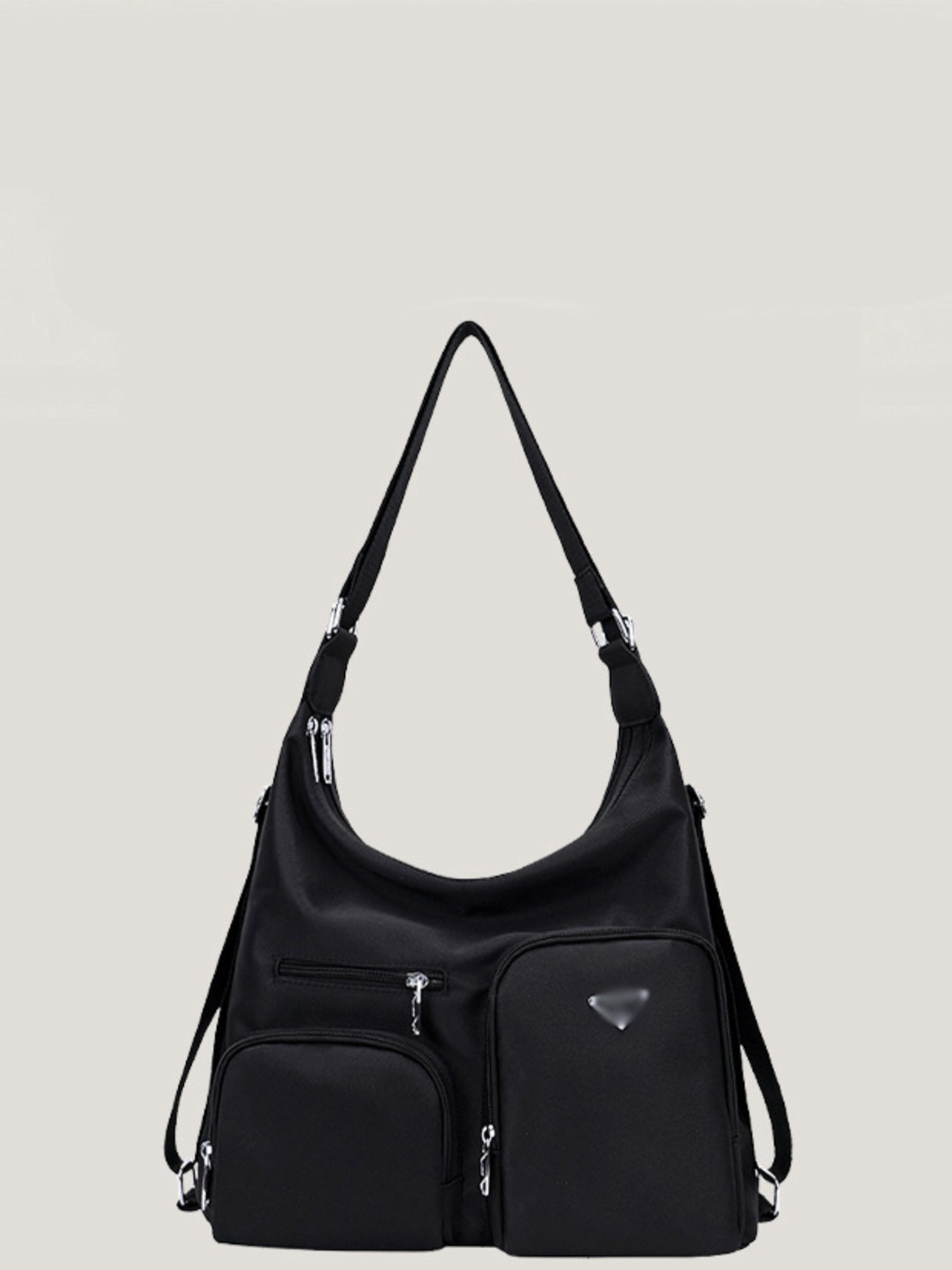 Black nylon shoulder bag with multiple exterior pockets and silver hardware.