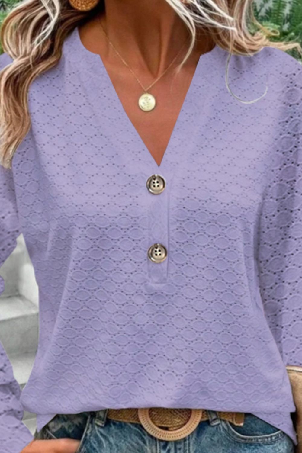 Lavender lace-effect henley blouse with decorative buttons and V-neck.