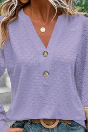 Lavender lace-effect henley blouse with decorative buttons and V-neck.