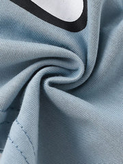 Blue cotton t-shirt with playful bear graphic and ruffled sleeves detail