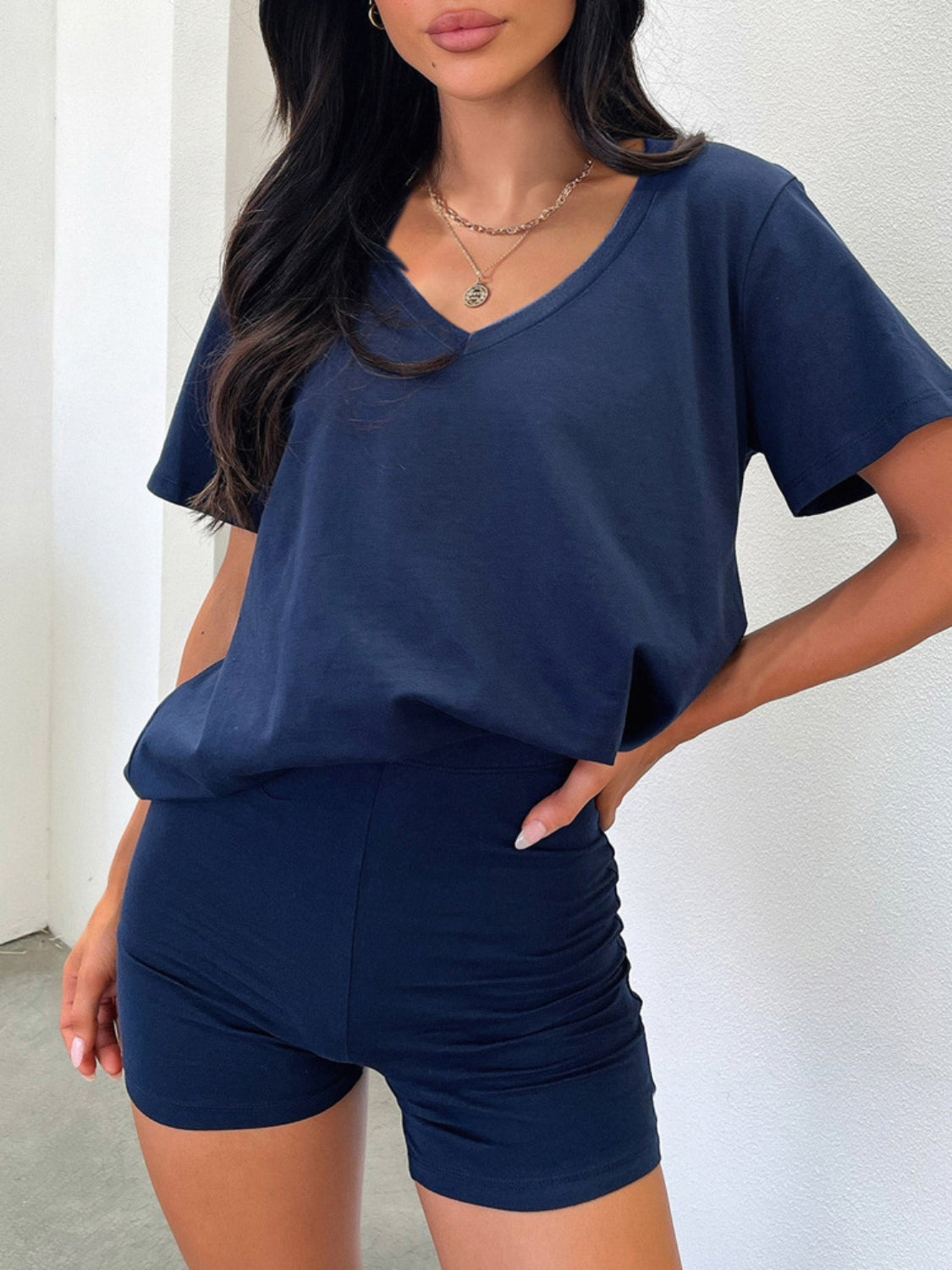 Navy v-neck lounge set with ruched shorts and a relaxed fit t-shirt.