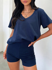 Navy v-neck lounge set with ruched shorts and a relaxed fit t-shirt.