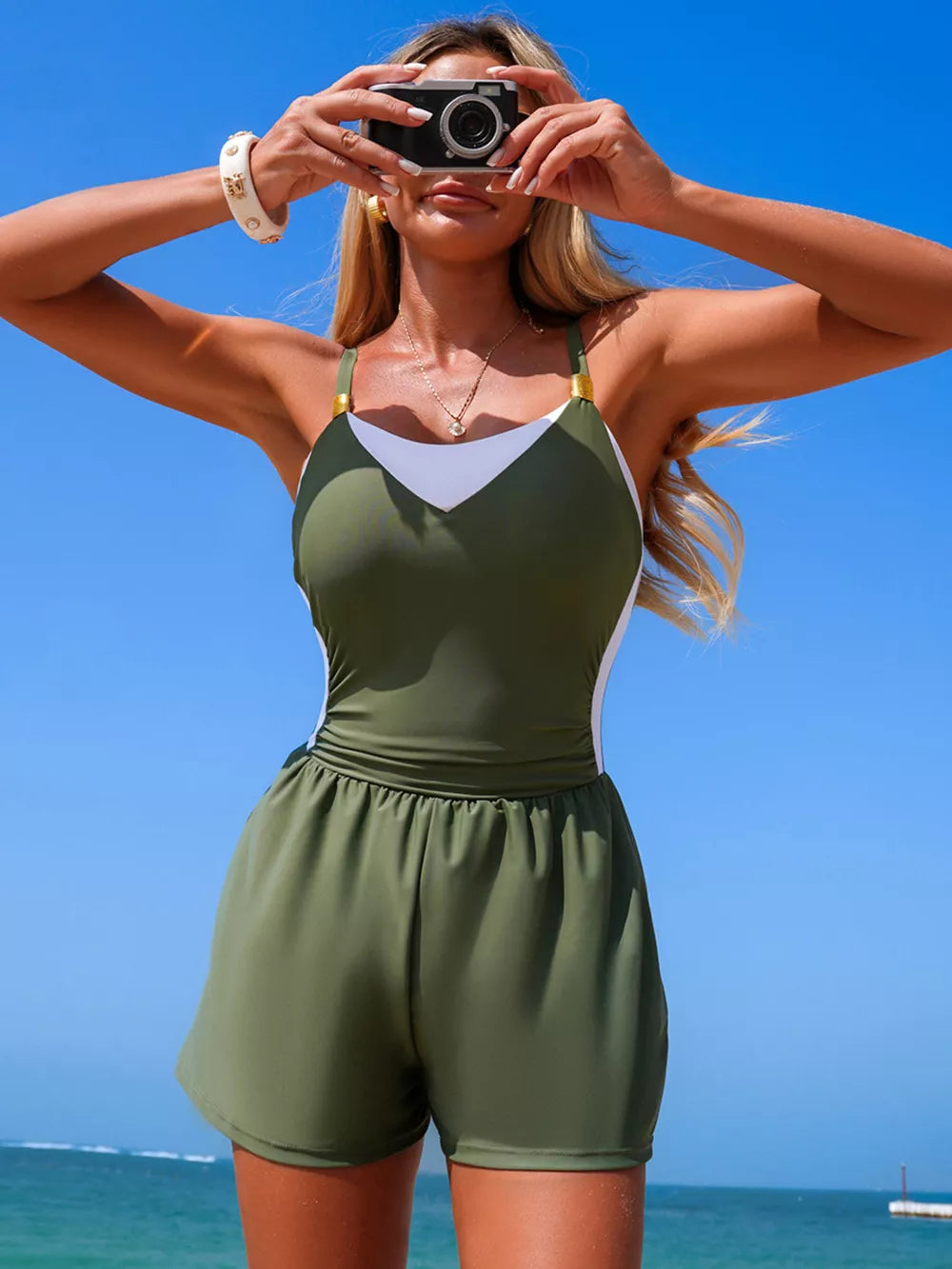 Chic color block one-piece swimsuit in army green and white with shorts.